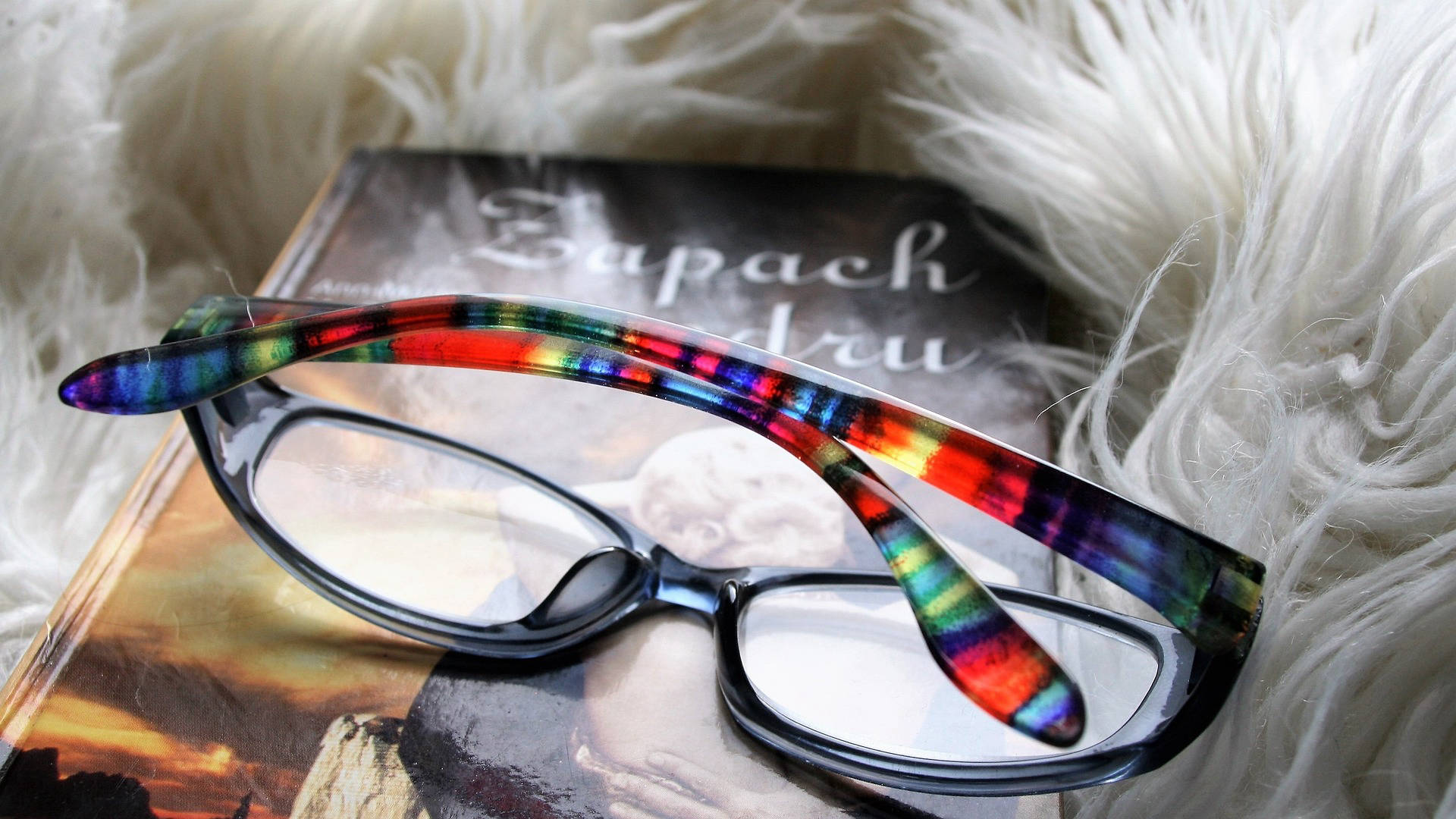 book with colorful glasses